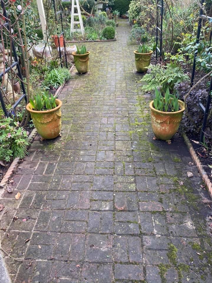 Removing dirt and stains from paving and concrete surfaces